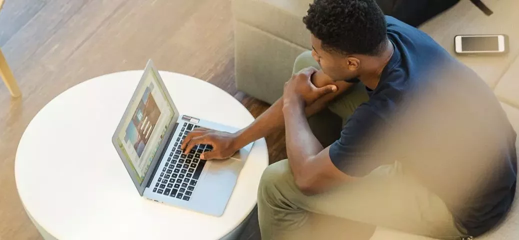 man working from home on laptop