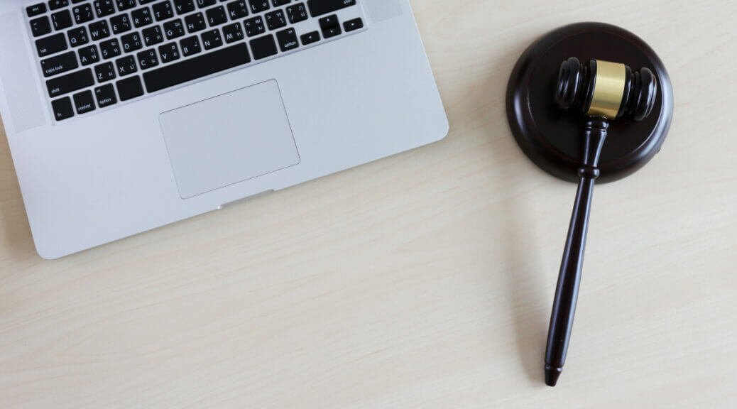 a gavel and a laptop