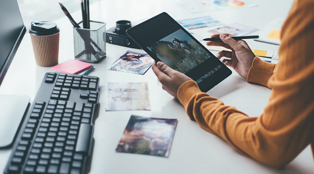 a person editing a photo on tablet