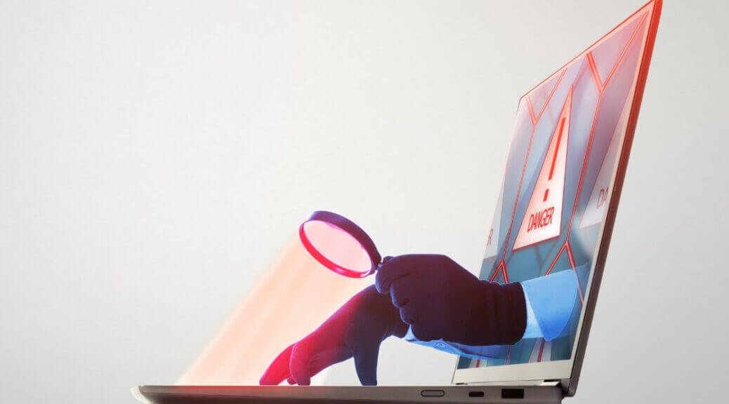 hands reaching through laptop monitor